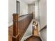 Bright hallway with hardwood floors and dark wood banister leading to the living room at 1202 Hardee Ne St, Atlanta, GA 30307