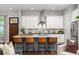 Modern kitchen with white cabinets, stainless steel appliances, and a granite kitchen island with seating at 1202 Hardee Ne St, Atlanta, GA 30307