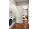 Convenient laundry room with modern washer and dryer, plus easy access to the adjacent bedroom at 1202 Hardee Ne St, Atlanta, GA 30307
