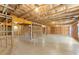 Unfinished basement with exposed ceiling and beams, providing ample potential for customization and expansion at 139 Treeline Trl, Canton, GA 30115
