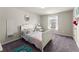 Cozy bedroom features carpet, natural light, a toddler vanity set, and a comfortable bed at 139 Treeline Trl, Canton, GA 30115