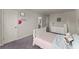 Bright bedroom features gray carpet, a comfortable bed, and plenty of room at 139 Treeline Trl, Canton, GA 30115
