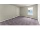 Bedroom with plush carpeting and a large window that provides abundant natural light at 139 Treeline Trl, Canton, GA 30115