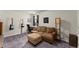Bonus room with a comfortable couch, workstation, and a fun, relaxed vibe at 139 Treeline Trl, Canton, GA 30115