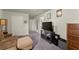 Bonus room with a comfortable couch, TV, and closet at 139 Treeline Trl, Canton, GA 30115