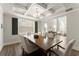 Elegant dining room with coffered ceilings, hardwood floors, and views of the living area at 139 Treeline Trl, Canton, GA 30115