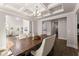 Dining room showcases a coffered ceiling and an open layout that connects to the living spaces at 139 Treeline Trl, Canton, GA 30115