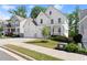 Charming two-story home featuring a manicured lawn, covered porch and an attached two-car garage at 139 Treeline Trl, Canton, GA 30115