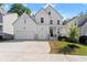 Charming two-story home boasts a welcoming front porch, a well-manicured lawn, and a two car garage at 139 Treeline Trl, Canton, GA 30115