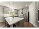 Stylish kitchen features a large center island, stainless steel appliances, and gray cabinets at 139 Treeline Trl, Canton, GA 30115