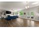 Spacious living room with a fireplace, built-in shelves, and patio doors leading to an outdoor area at 139 Treeline Trl, Canton, GA 30115