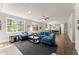 Spacious living room flows into an open floorplan with the kitchen featuring lots of natural light at 139 Treeline Trl, Canton, GA 30115