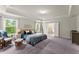 Large main bedroom boasts natural light, seating area, and en-suite bathroom at 139 Treeline Trl, Canton, GA 30115