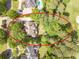 Aerial view of a private residence surrounded by mature trees at 5650 Buckleigh Pointe, Suwanee, GA 30024