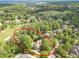 Overhead view of a home surrounded by lush greenery and mature trees at 5650 Buckleigh Pointe, Suwanee, GA 30024
