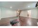 Open basement space with hardwood flooring offers plenty of potential for customization at 5650 Buckleigh Pointe, Suwanee, GA 30024