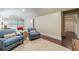 Bright bedroom with two chairs and a partial view of a comfy bed and a window at 5650 Buckleigh Pointe, Suwanee, GA 30024