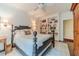 Inviting bedroom with custom bookshelves and a decorative bed, offering comfort and charm at 5650 Buckleigh Pointe, Suwanee, GA 30024