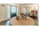 Elegant home entryway featuring a frosted glass door and decorative table at 5650 Buckleigh Pointe, Suwanee, GA 30024
