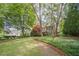 A well-manicured front lawn and meticulously maintained landscaping surround this lovely home at 5650 Buckleigh Pointe, Suwanee, GA 30024