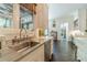 Kitchen with stainless steel sink, marble backsplash, and dark hardwood floors at 5650 Buckleigh Pointe, Suwanee, GA 30024
