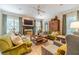 Elegant living room with fireplace, hardwood floors, and ample natural light at 5650 Buckleigh Pointe, Suwanee, GA 30024