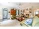 Inviting living room features built-in bookshelves, hardwood floors, and comfortable seating arrangements at 5650 Buckleigh Pointe, Suwanee, GA 30024