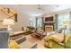 Spacious living room features a fireplace, large windows, and comfortable seating at 5650 Buckleigh Pointe, Suwanee, GA 30024
