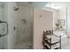 This bathroom offers a glass enclosed shower with marble walls and floor at 5650 Buckleigh Pointe, Suwanee, GA 30024