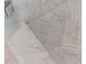 Close up of the beautiful mosaic tile floor of the marble shower stall at 5650 Buckleigh Pointe, Suwanee, GA 30024