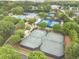 Aerial view of tennis courts, swimming pool, and landscaping at the community clubhouse at 5650 Buckleigh Pointe, Suwanee, GA 30024