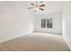 Bright bedroom with vaulted ceiling, ceiling fan, large window, and carpeted flooring at 1065 City Park Dr, Mcdonough, GA 30252
