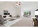 Open-concept living area with vaulted ceilings, plush carpet, and modern décor connecting living and dining spaces at 1065 City Park Dr, Mcdonough, GA 30252