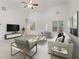 Bright, airy living room with vaulted ceilings, plush carpet, and modern furnishings for comfortable living at 1065 City Park Dr, Mcdonough, GA 30252