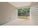 Covered patio with concrete flooring and a view of the fenced backyard at 1065 City Park Dr, Mcdonough, GA 30252