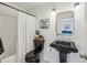 Bathroom features black pedestal sink, patterned tile and modern fixtures at 1229 Concord Se Rd, Smyrna, GA 30080