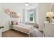 Charming bedroom with soft colors, decorative floral accents, and a cozy window seat at 1229 Concord Se Rd, Smyrna, GA 30080