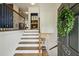 Welcoming entryway features hardwood stairs, a stylish door, and a decorative wreath at 1229 Concord Se Rd, Smyrna, GA 30080