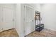 Hallway with tiled floors, coat rack, and a louvered door at 1229 Concord Se Rd, Smyrna, GA 30080