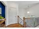 Upstairs hallway with hardwood floors, modern lighting, and a view of the entry and staircase at 1229 Concord Se Rd, Smyrna, GA 30080