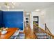 Hallway leading from the dining area showcases wood floors, an open layout, and a staircase at 1229 Concord Se Rd, Smyrna, GA 30080