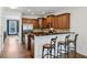 Well-lit kitchen features ample cabinets, granite countertops, stainless appliances, and breakfast bar seating at 1229 Concord Se Rd, Smyrna, GA 30080