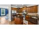 Spacious kitchen with stainless appliances, wood cabinets, granite countertops, and hardwood flooring at 1229 Concord Se Rd, Smyrna, GA 30080