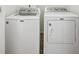 Laundry room with a white Maytag washer and dryer set at 1229 Concord Se Rd, Smyrna, GA 30080