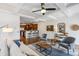 Inviting living room featuring a ceiling fan, modern decor, and seamless access to the open-concept kitchen at 1229 Concord Se Rd, Smyrna, GA 30080