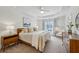 Serene main bedroom featuring a large bed, ample natural light, and modern furnishings, offering a relaxing retreat at 1229 Concord Se Rd, Smyrna, GA 30080