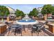 Outdoor seating area with tables and a water fountain located amongst apartments and green space at 1229 Concord Se Rd, Smyrna, GA 30080