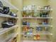 Organized pantry with wire shelving stocked with various food and kitchen items at 1229 Concord Se Rd, Smyrna, GA 30080
