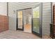 Stylish outdoor deck area with black framed glass doors opening to a view of the house's interior at 2327 Mason Dr # D23, Atlanta, GA 30316