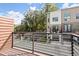Townhouse balcony with iron railing offering views of the neighborhood and green landscaping at 2327 Mason Dr # D23, Atlanta, GA 30316
